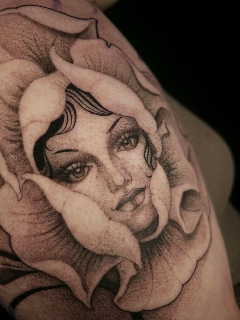 Tattoo by @swirly.boi — realism, black_and_grey