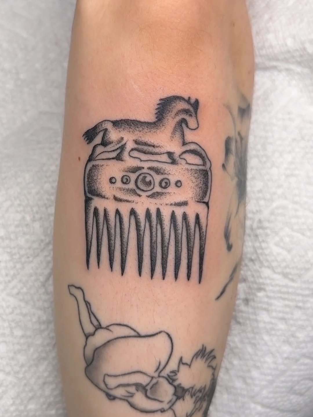 Tattoo by @rinoski.tattoo — illustrative, black_and_grey