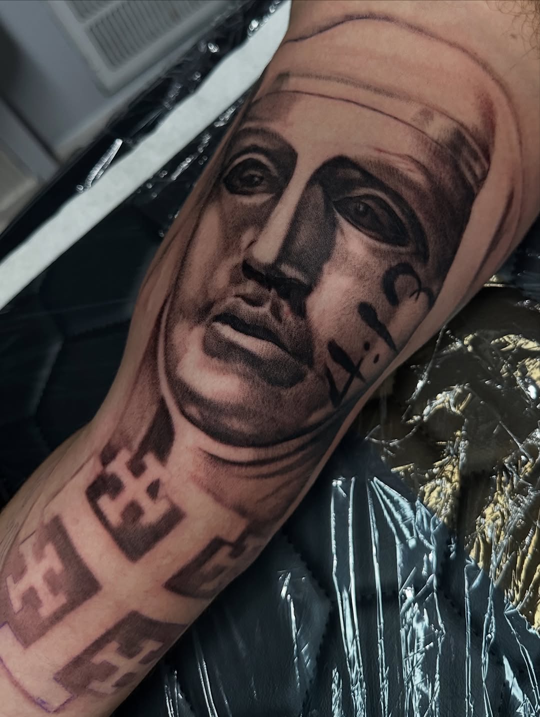 Tattoo by @tattooz_by_trent — realism, black_and_grey