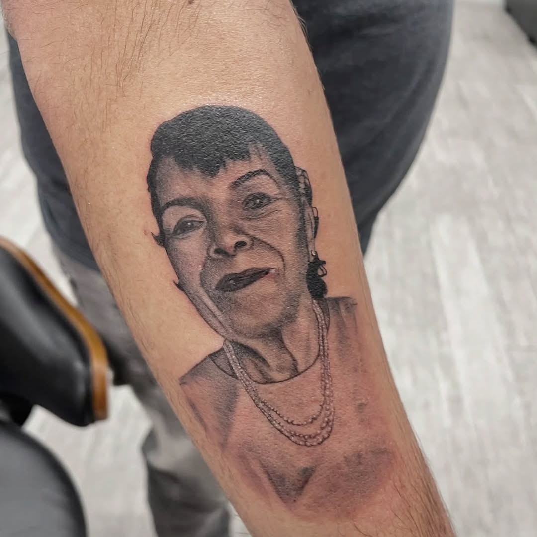 Tattoo by @m3ga.p1xlz — realism, black_and_grey