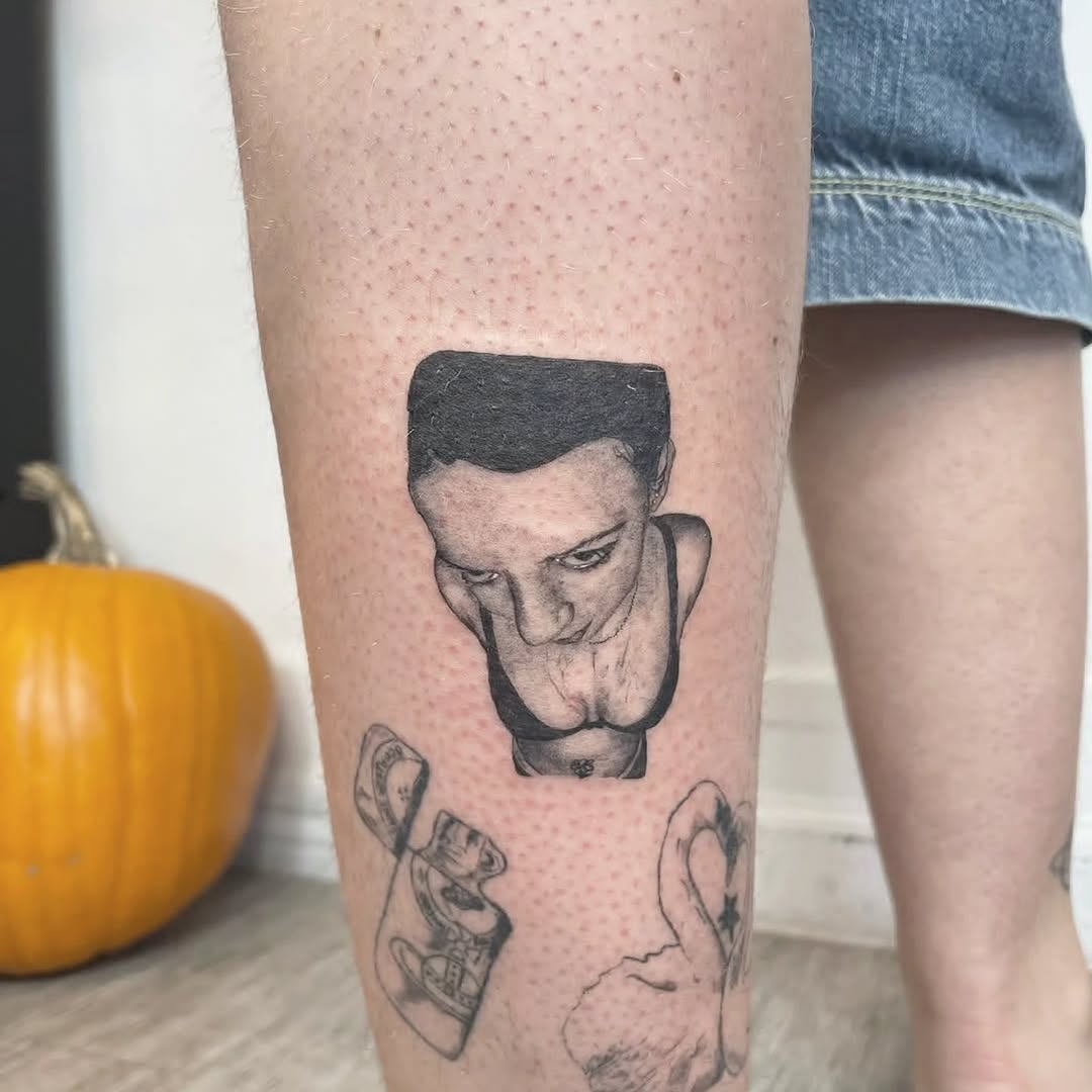 Tattoo by @m3ga.p1xlz — realism, black_and_grey