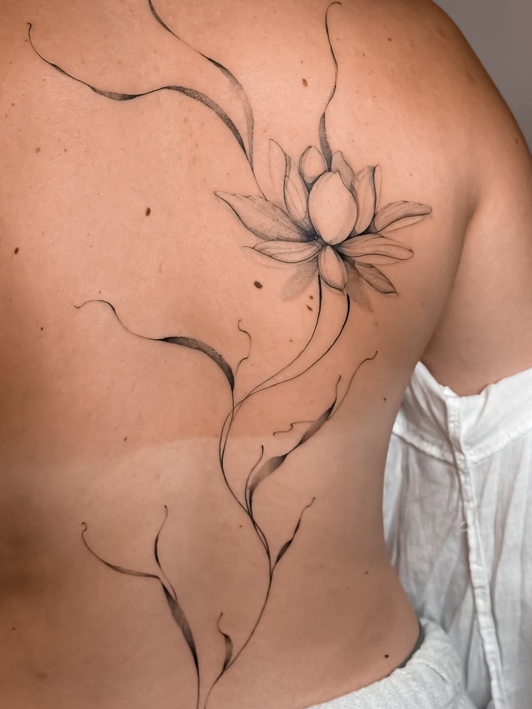 Tattoo by @badlildiva.tattoo — fine_line, black_and_grey
