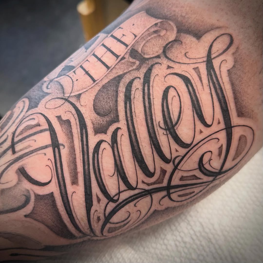 Tattoo by @tattoosbyskip — lettering_script, chicano