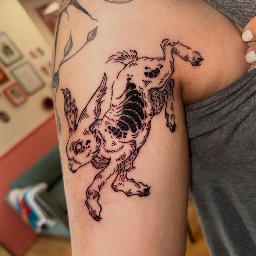 Tattoo by @laurito_tattoo — illustrative, blackwork