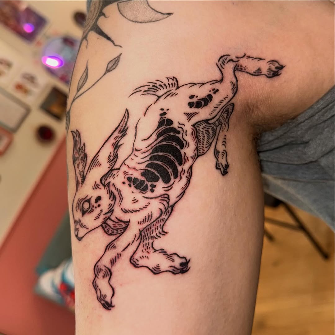 Tattoo by @laurito_tattoo — illustrative, blackwork