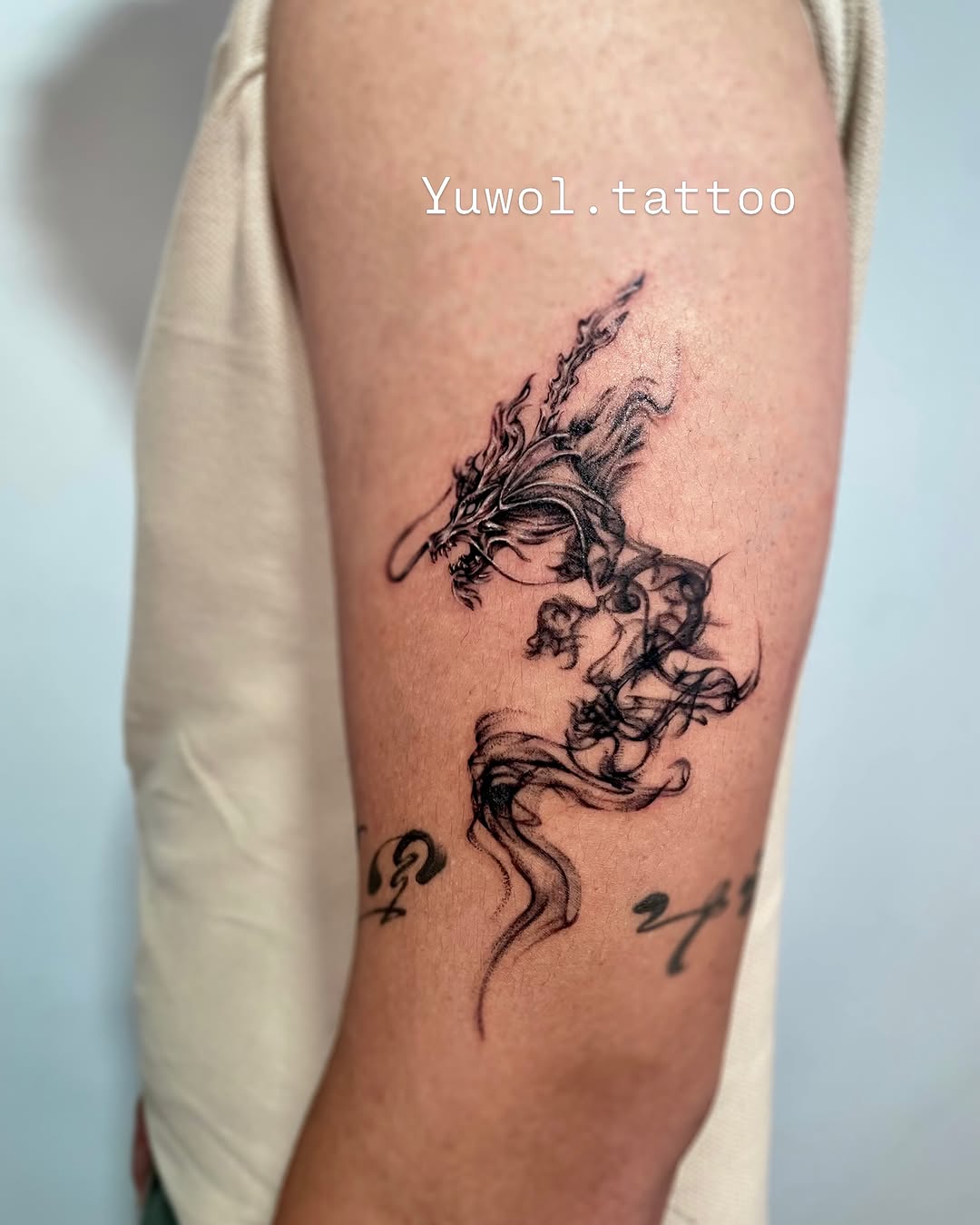 Tattoo by @yuwol.tattoo — black_and_grey, illustrative