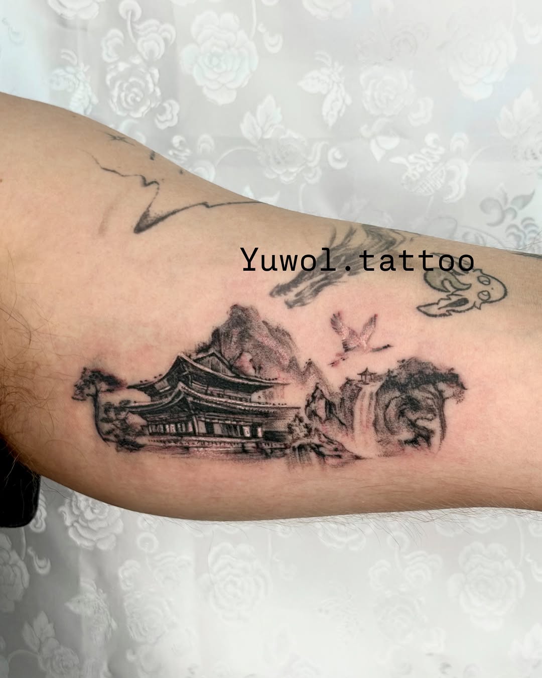 Tattoo by @yuwol.tattoo — realism, black_and_grey
