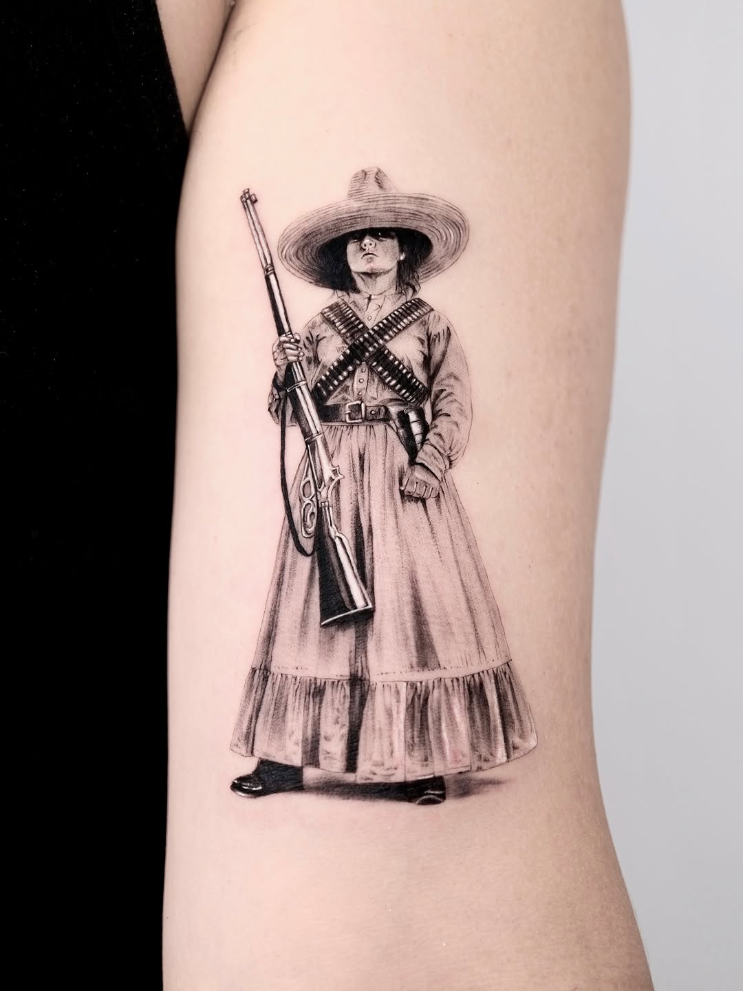 Tattoo by @tattooer.ari โ realism, black_and_grey