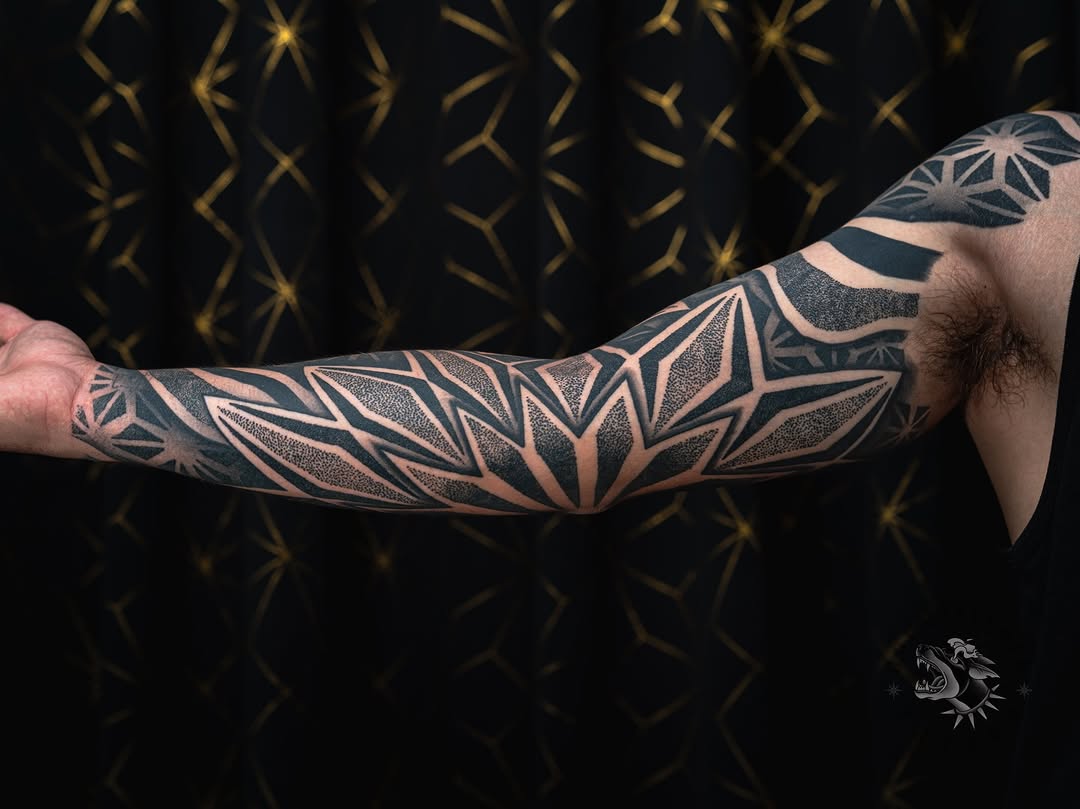Tattoo by @sacredhound.ttt — geometric, dotwork