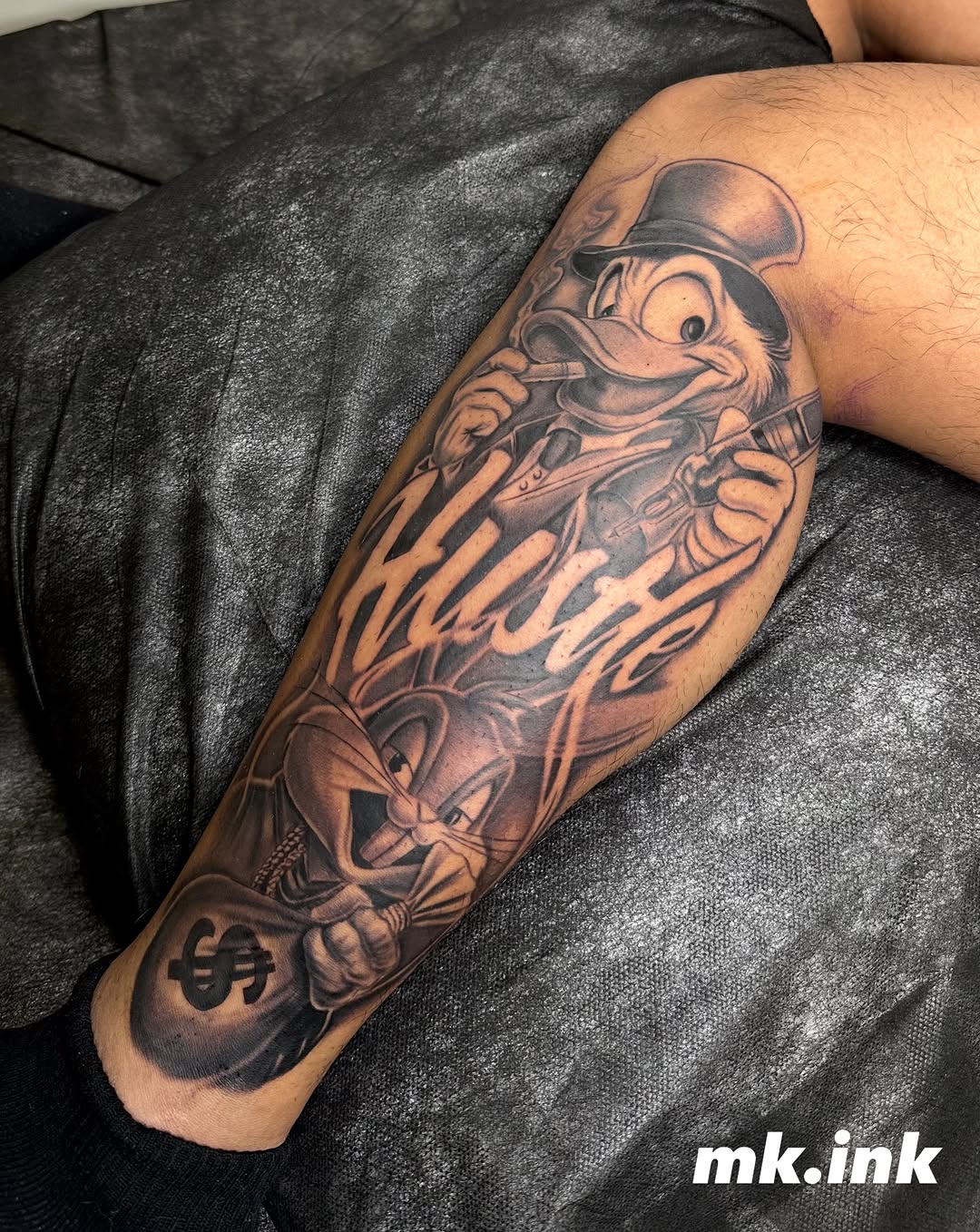 Tattoo by @mkv.ink — black_and_grey, illustrative