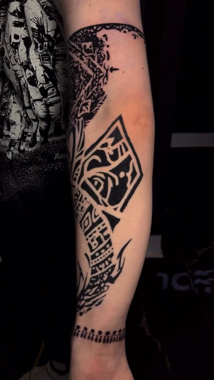 Tattoo by @grimlayertattoo — geometric, blackwork