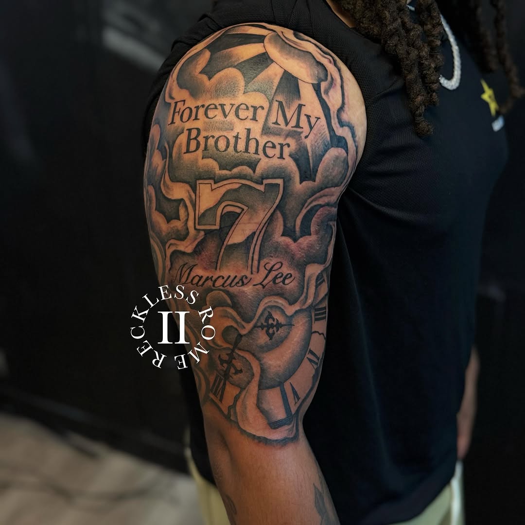 Tattoo by @2reckless__rome — black_and_grey, lettering_script