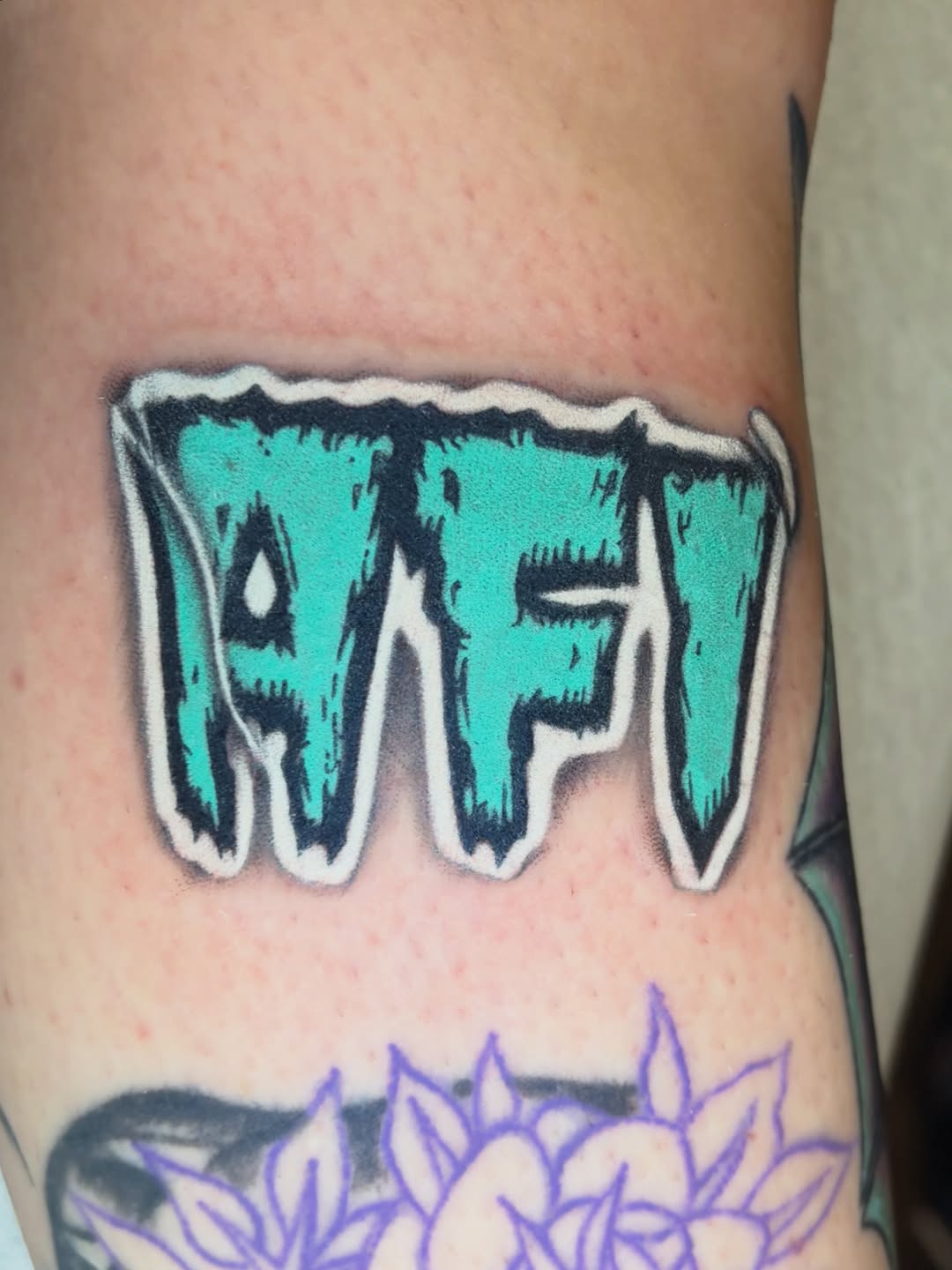 Tattoo by @grimdark.art — lettering_script