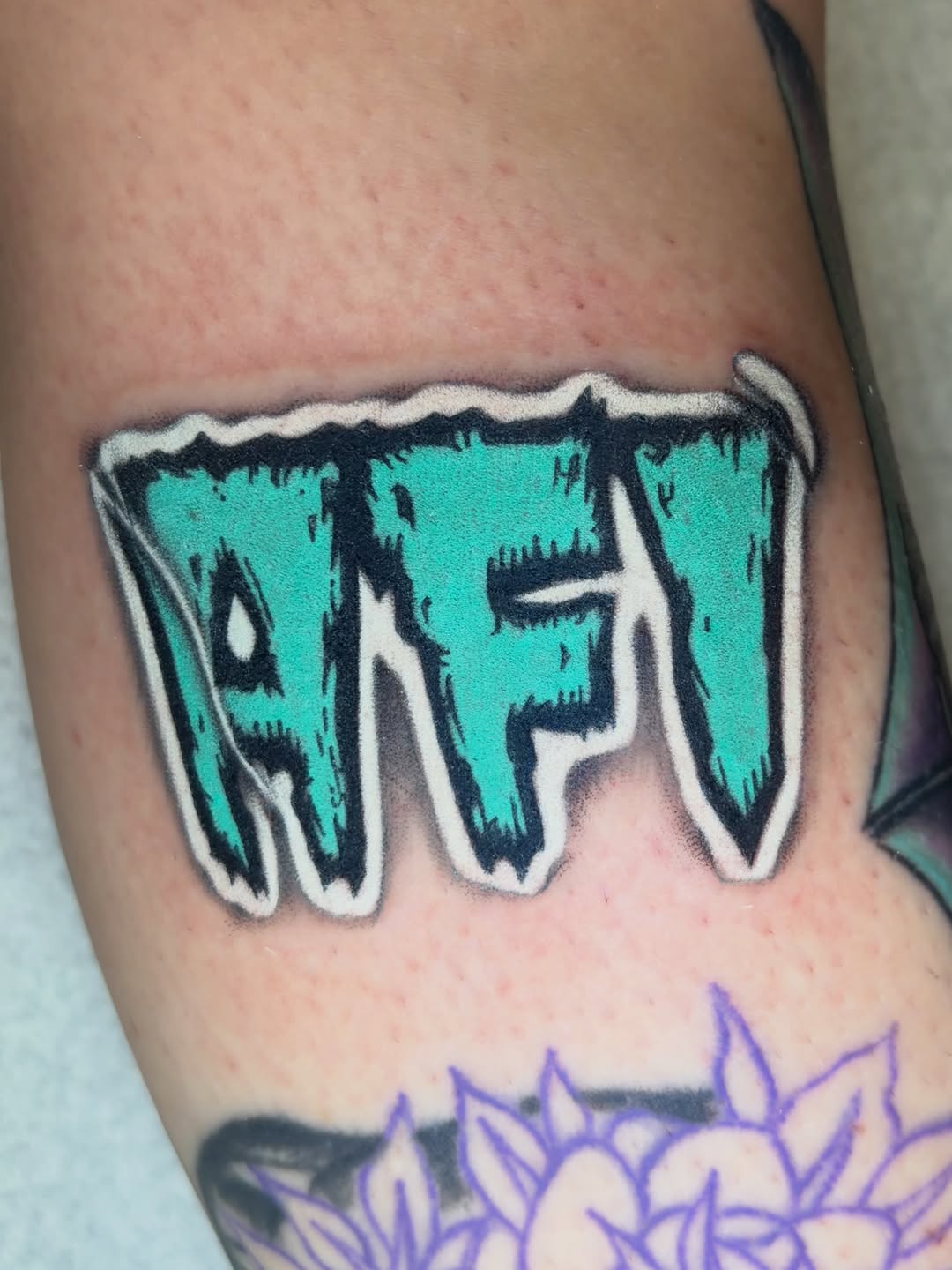 Tattoo by @grimdark.art — lettering_script
