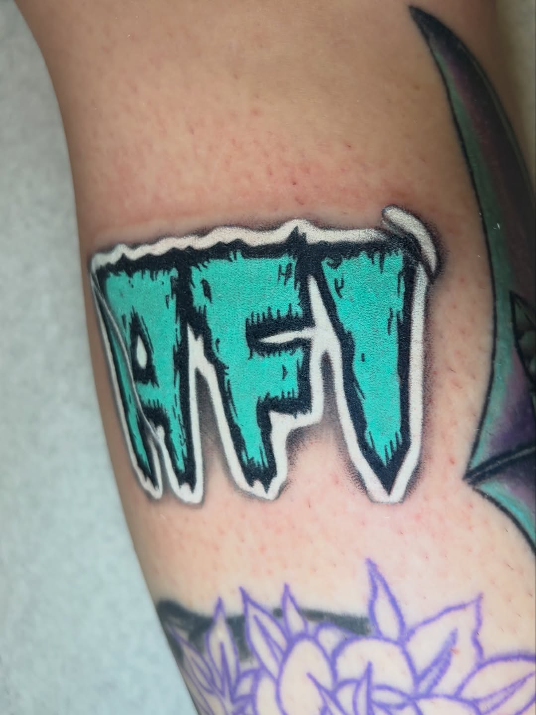 Tattoo by @grimdark.art — lettering_script