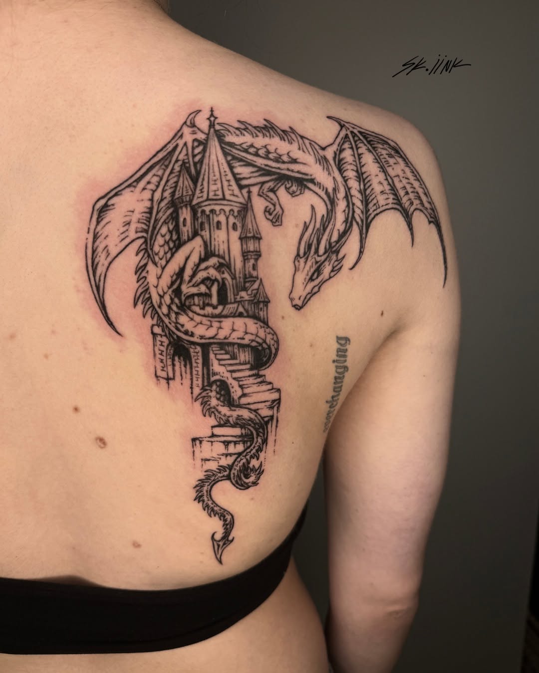 Tattoo by @sk.iink — illustrative, blackwork