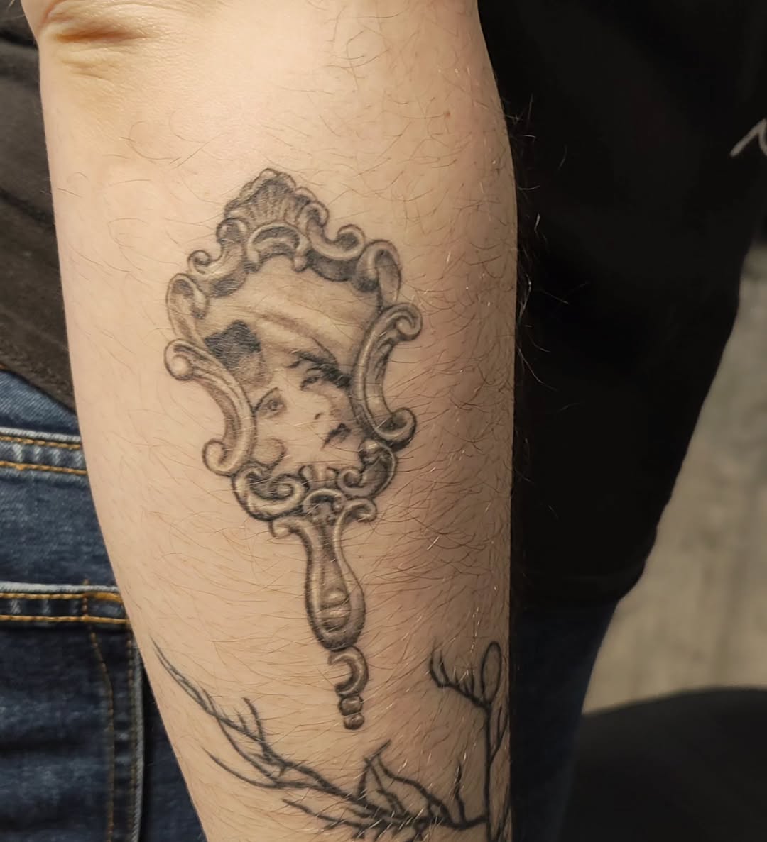 Tattoo by @m3ga.p1xlz — realism, black_and_grey