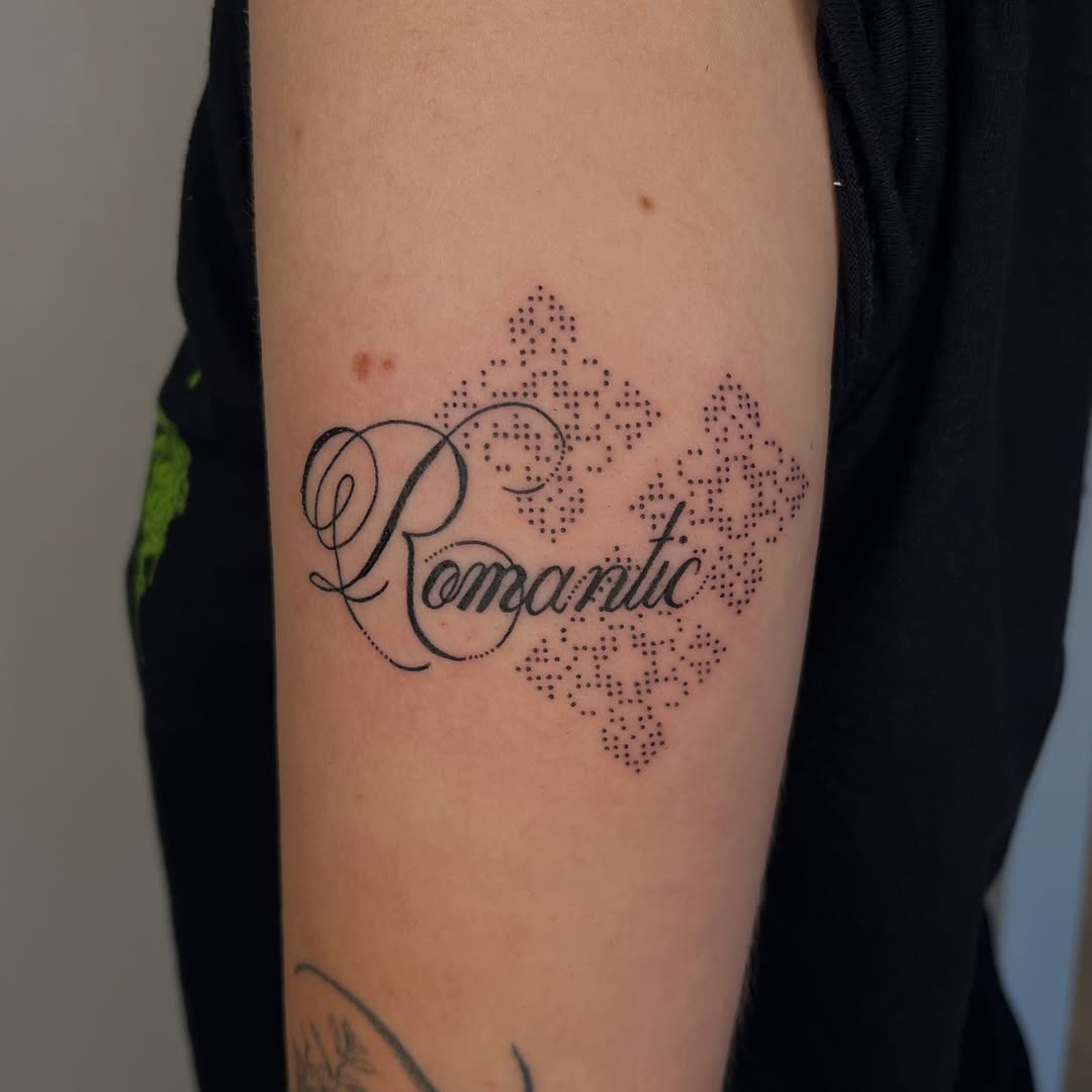 Tattoo by @toughbutton.tats — lettering_script, dotwork