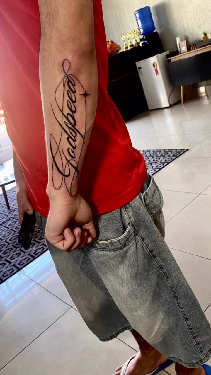 Tattoo by @thaina.otero — lettering_script, fine_line