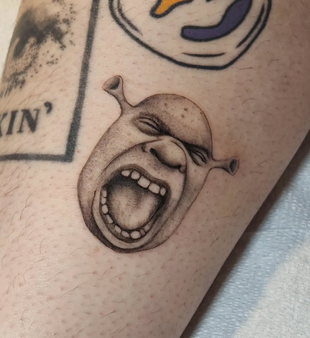 Tattoo by @m3ga.p1xlz — realism, black_and_grey
