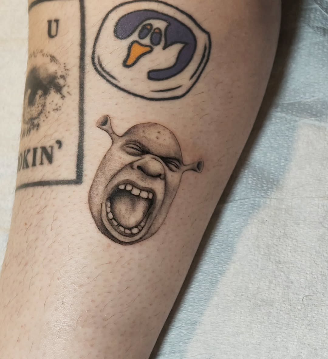 Tattoo by @m3ga.p1xlz — realism, black_and_grey
