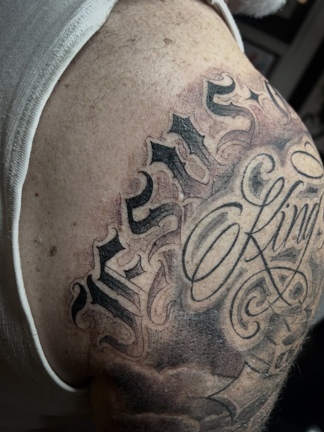 Tattoo by @osopolar_tattoos — lettering_script, black_and_grey