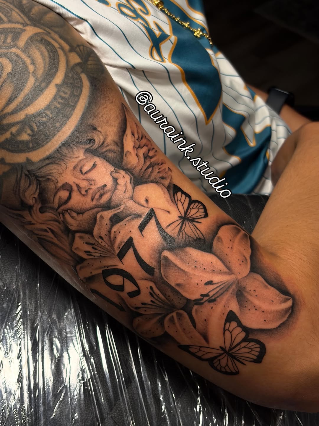 Tattoo by @auraink.studio β realism, black_and_grey