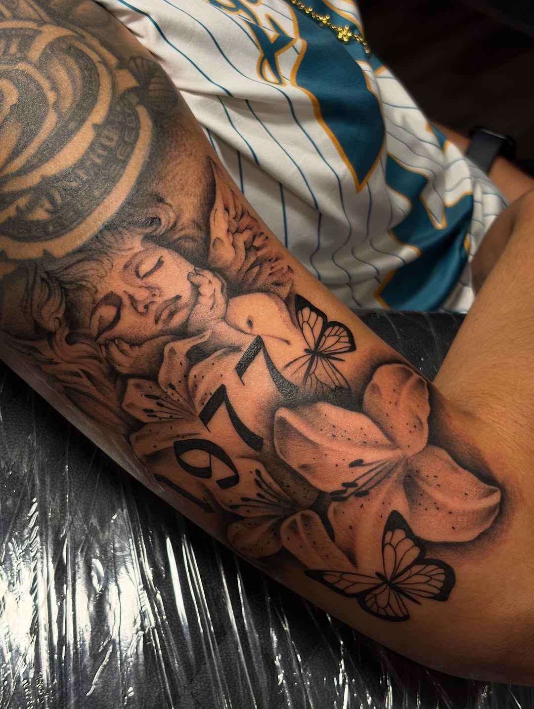 Tattoo by @auraink.studio β realism, black_and_grey