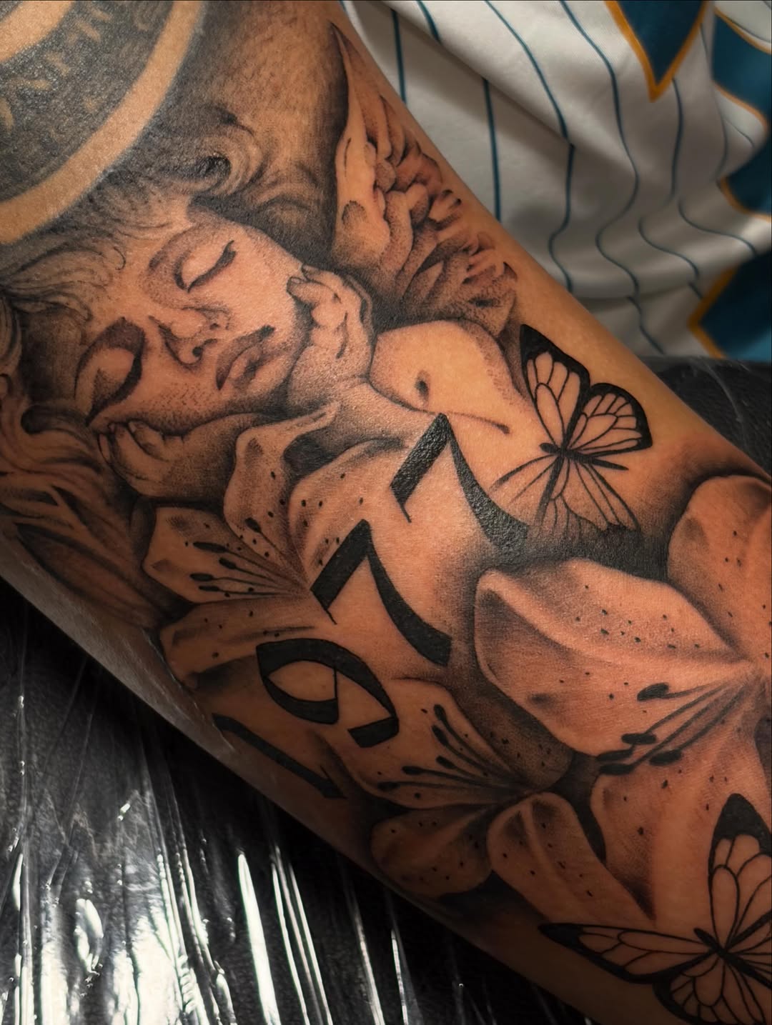 Tattoo by @auraink.studio β realism, black_and_grey