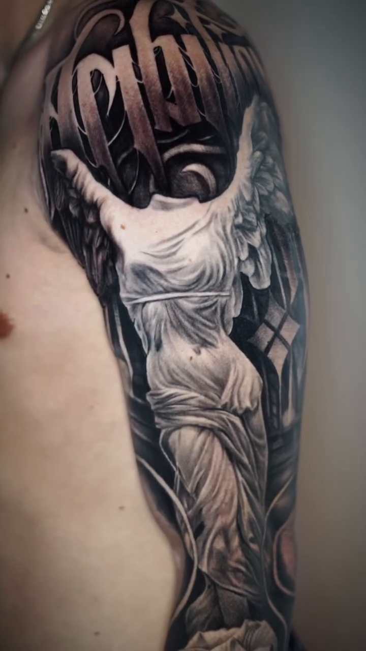 Tattoo by @angelo_tattooink โ realism, black_and_grey