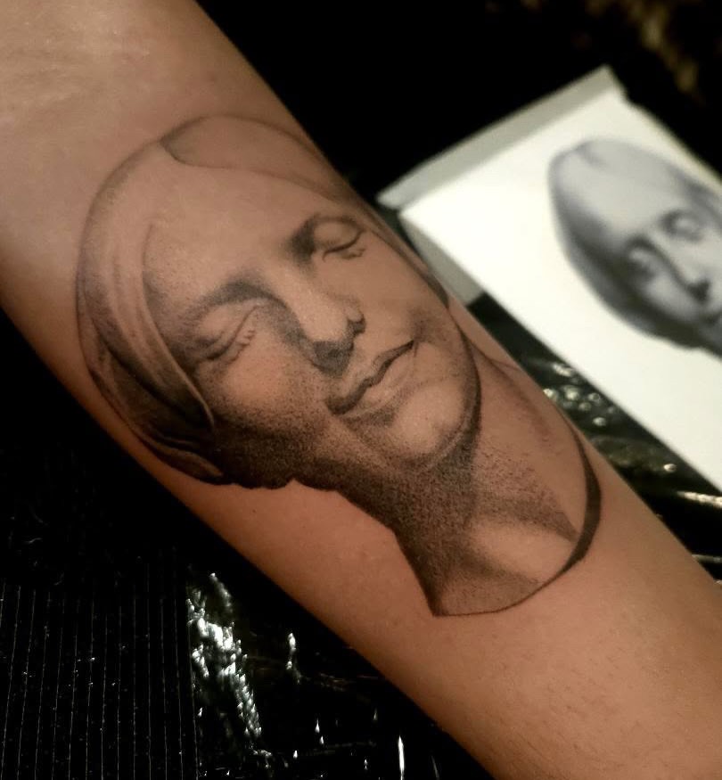 Tattoo by @swirly.boi — realism, black_and_grey