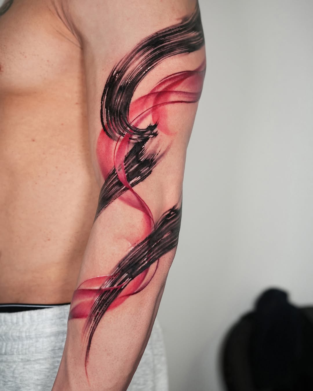 Tattoo by @jiya.brush — watercolor, blackwork