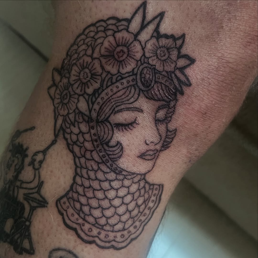 Tattoo by @tattoos_by_evan_i — illustrative, blackwork