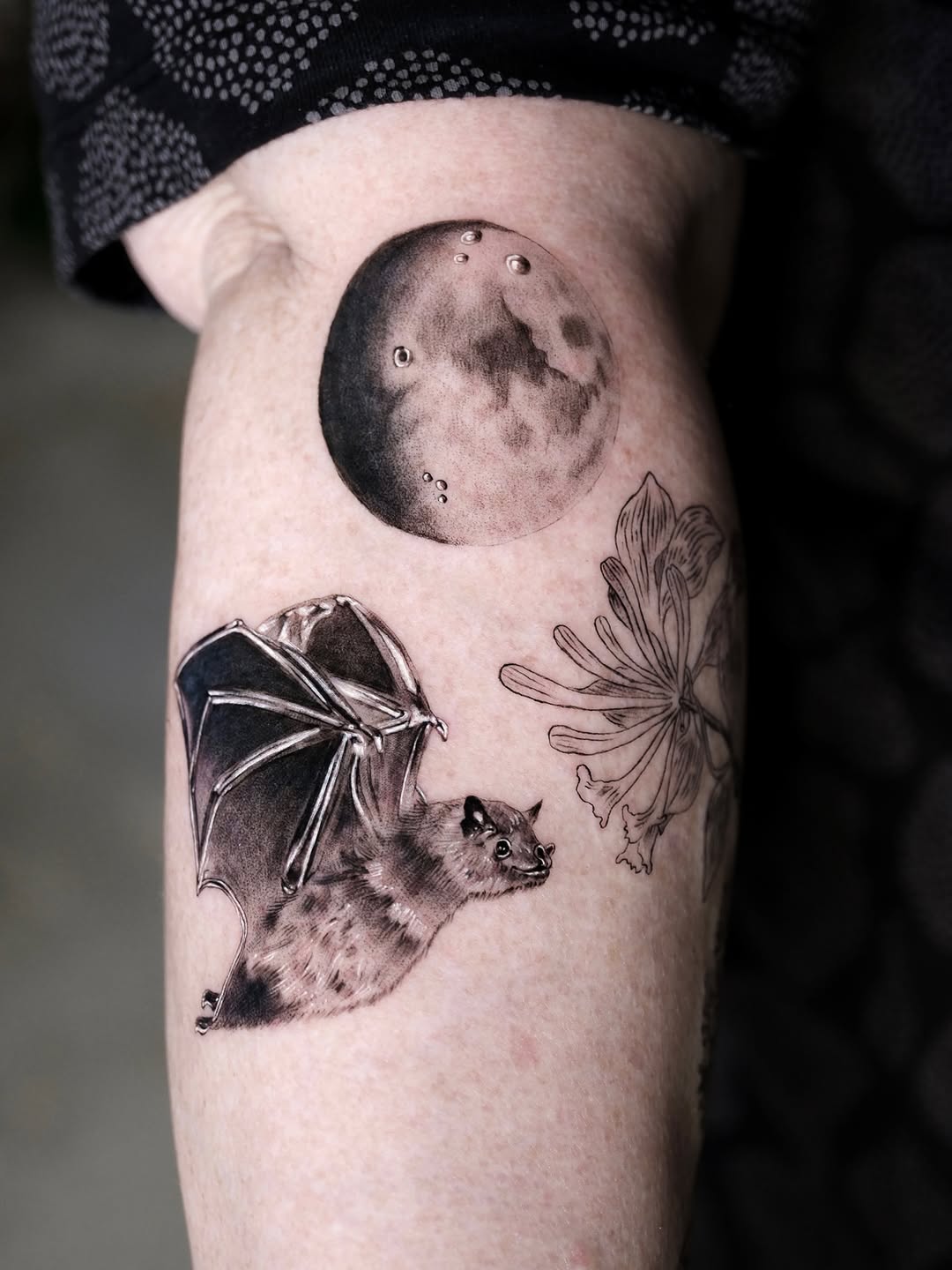 Tattoo by @tattooer.ari โ realism, black_and_grey