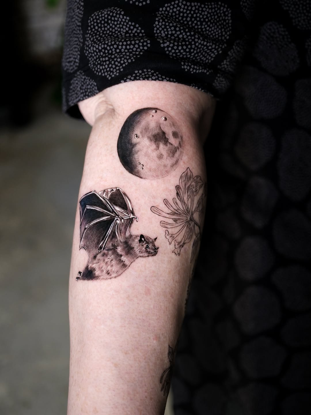 Tattoo by @tattooer.ari โ realism, black_and_grey