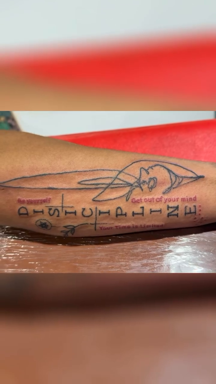 Tattoo by @tyd_inkedbybige — illustrative, lettering_script