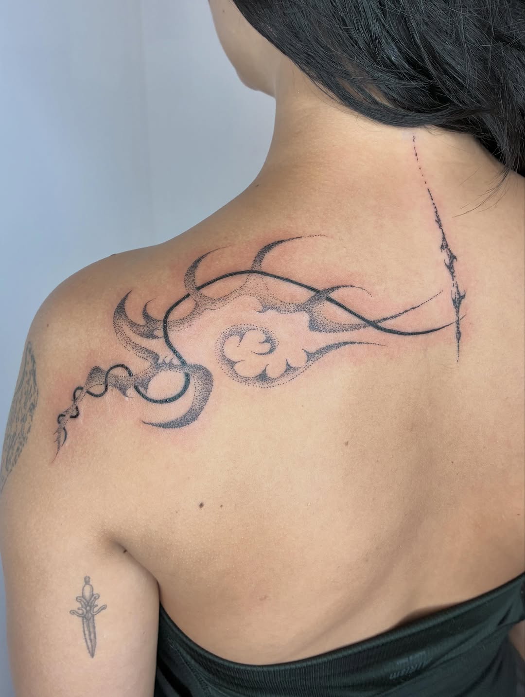 Tattoo by @geisha_ocelotl — illustrative, dotwork