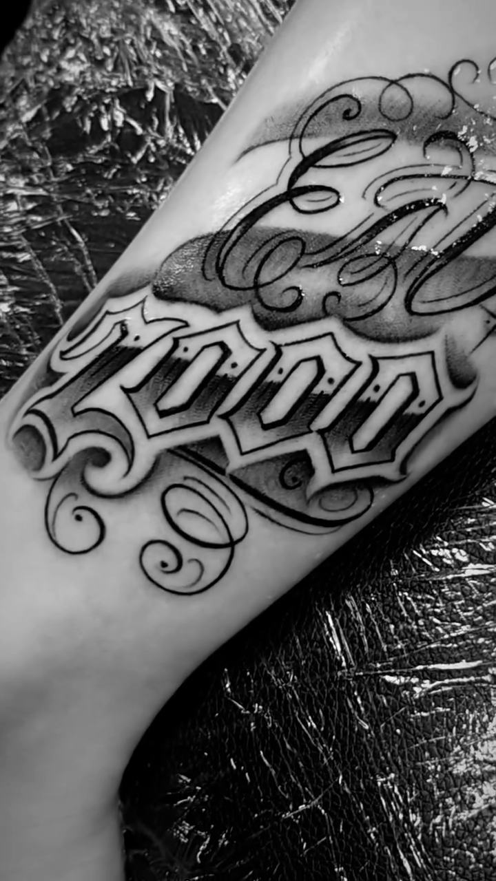 Tattoo by @tattoo_seez โ lettering_script, black_and_grey