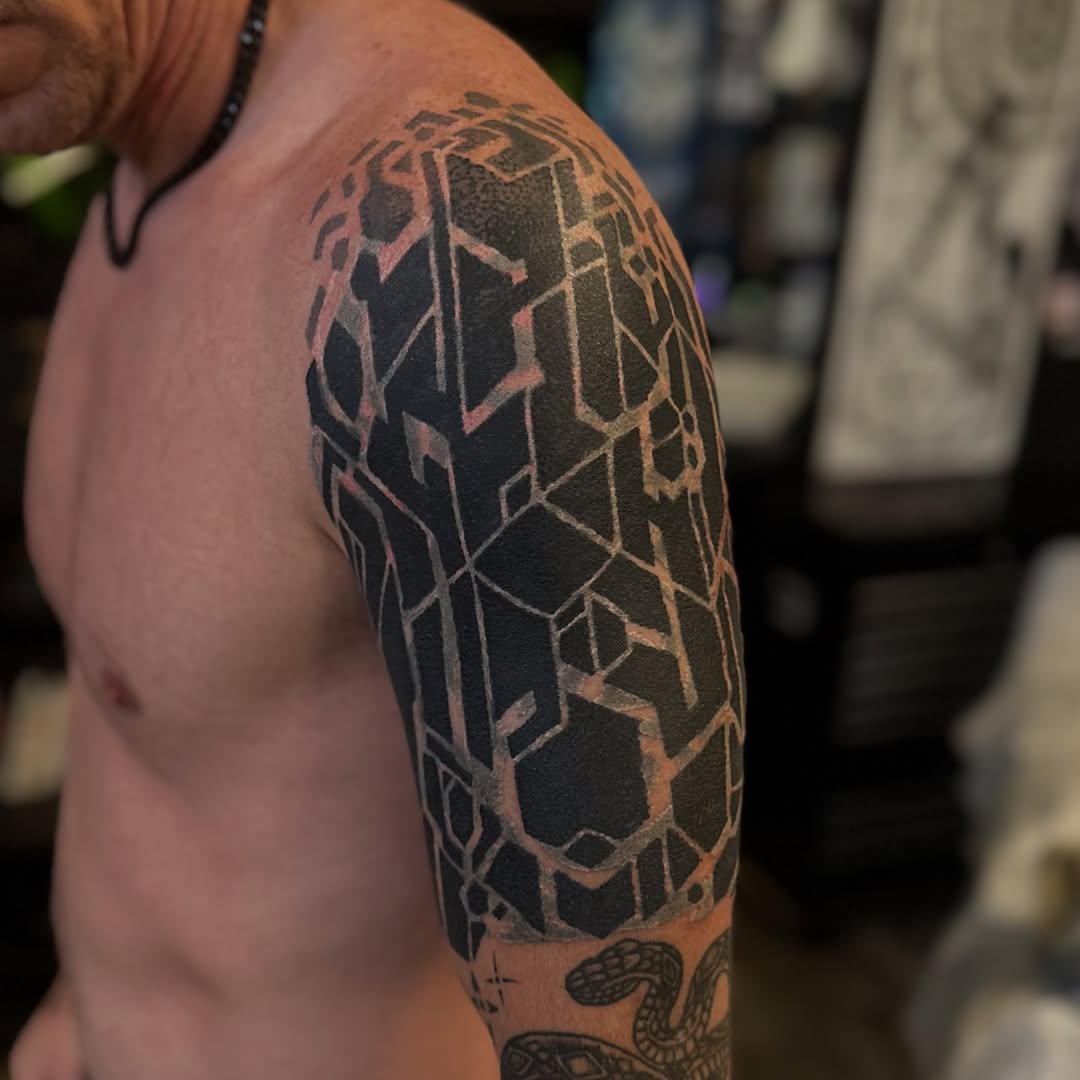 Tattoo by @jon.miller.tattoo — geometric, blackwork