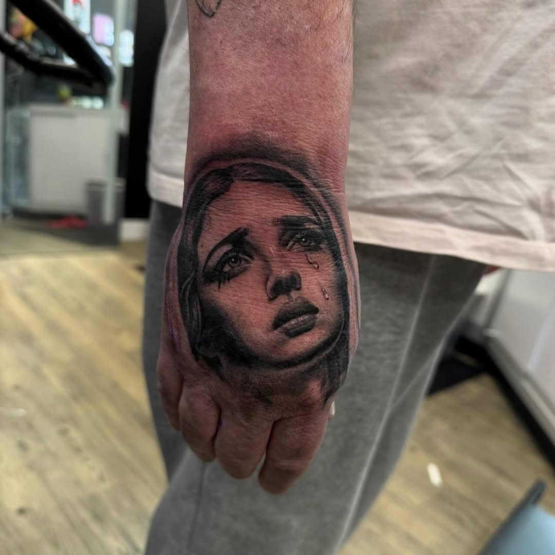 Tattoo by @weaponized_onion โ realism, black_and_grey