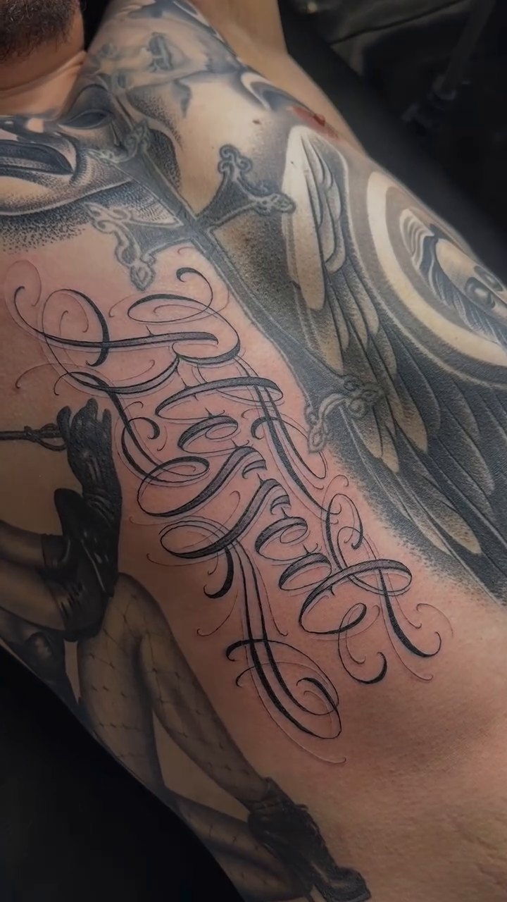 Tattoo by @scriptinator — lettering_script, black_and_grey