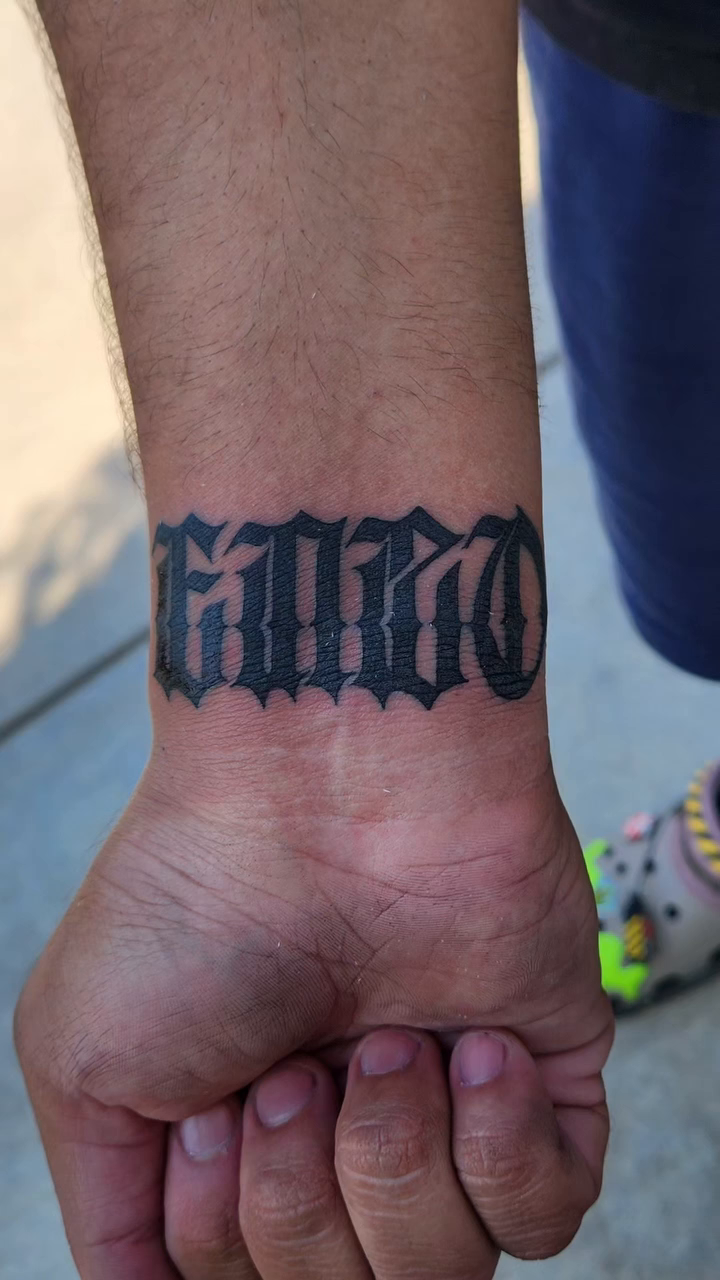 Tattoo by @youxg_guxxz — lettering_script, blackwork