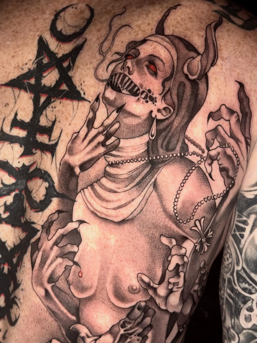 Tattoo by @mad_s_ink — dark_realism, black_and_grey