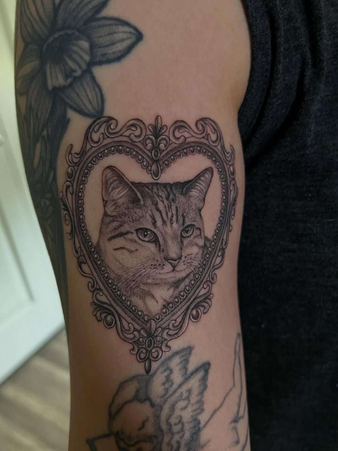 Tattoo by @iraymi.tattoos โ realism, black_and_grey