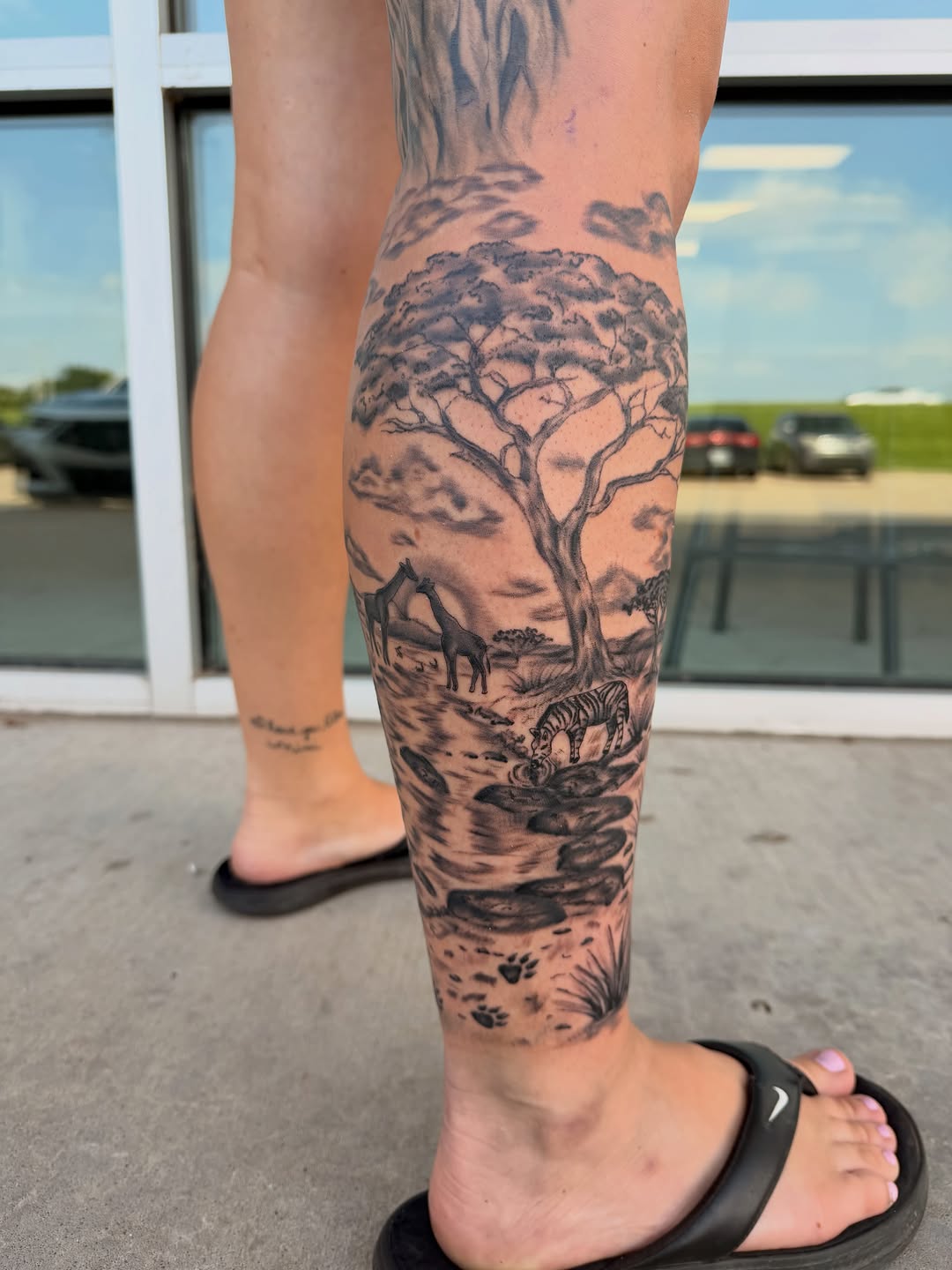 Tattoo by @lexiodam_tattoos — realism, black_and_grey