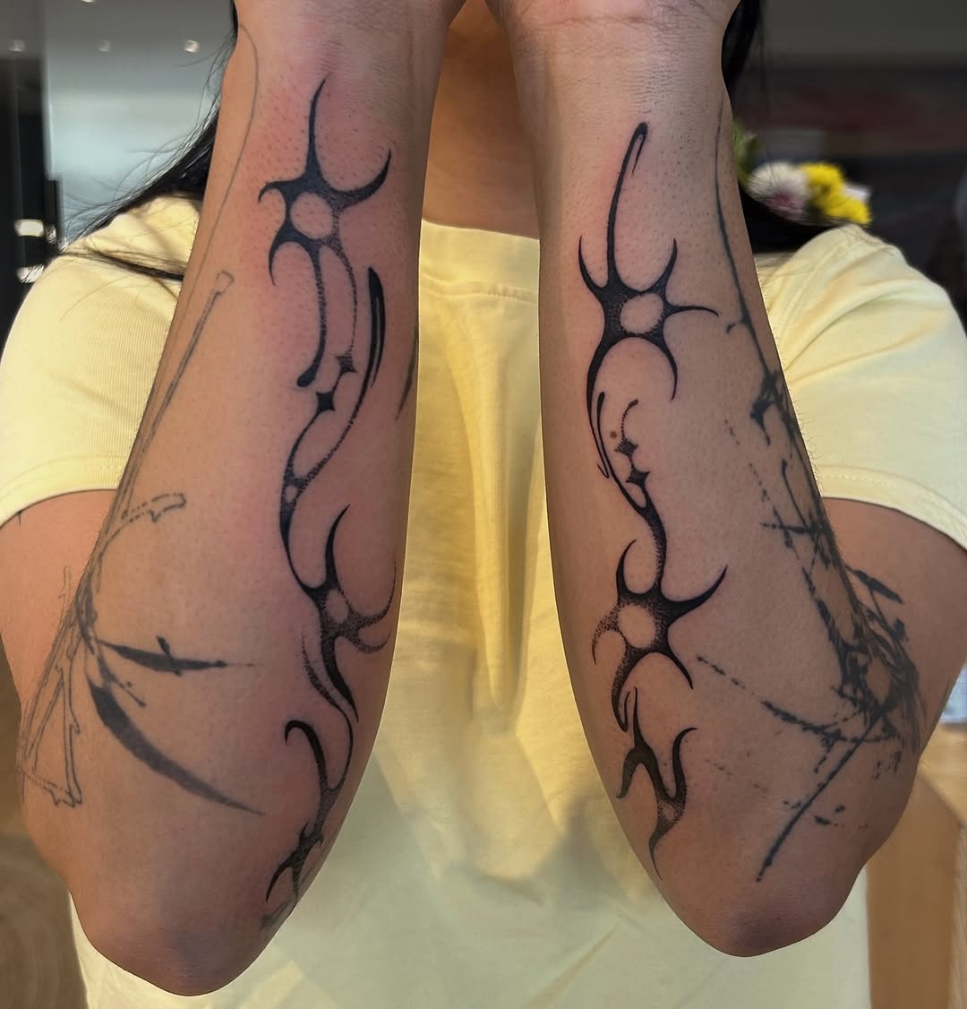 Tattoo by @oolong.ink — tribal, dotwork