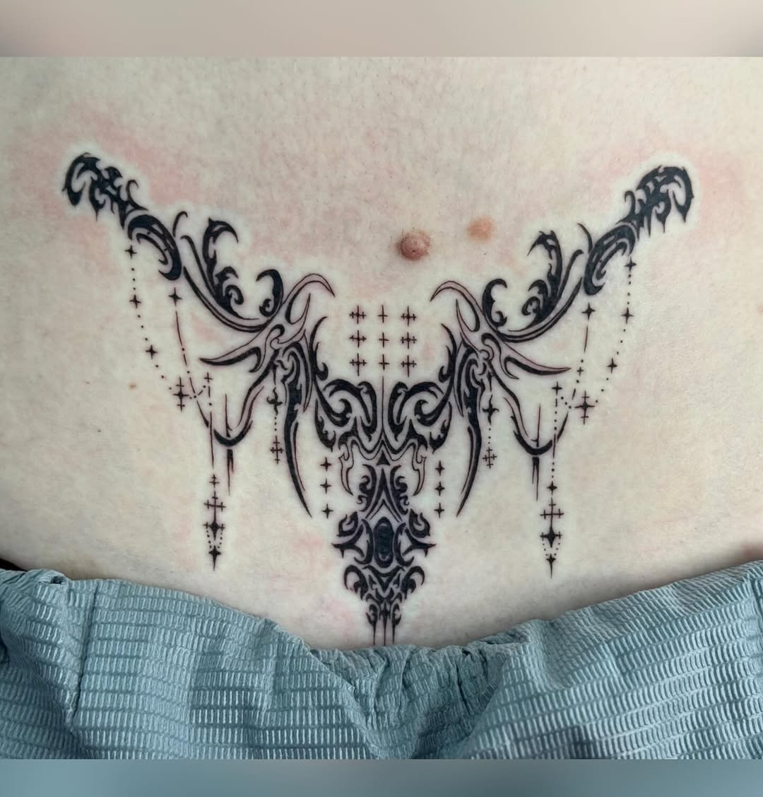 Tattoo by @writhingdirty — ornamental, blackwork