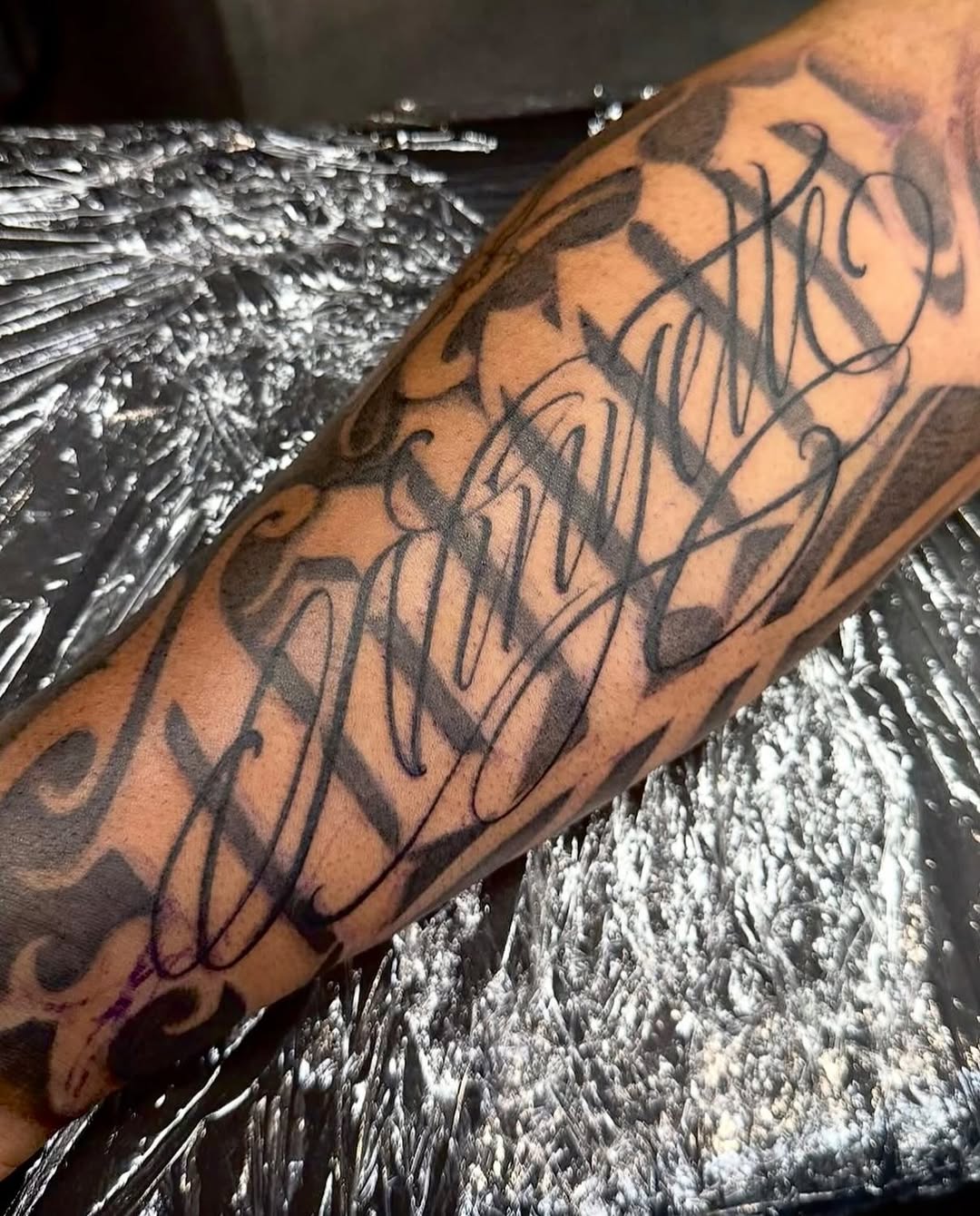 Tattoo by @dopeletterstattoo — lettering_script, chicano