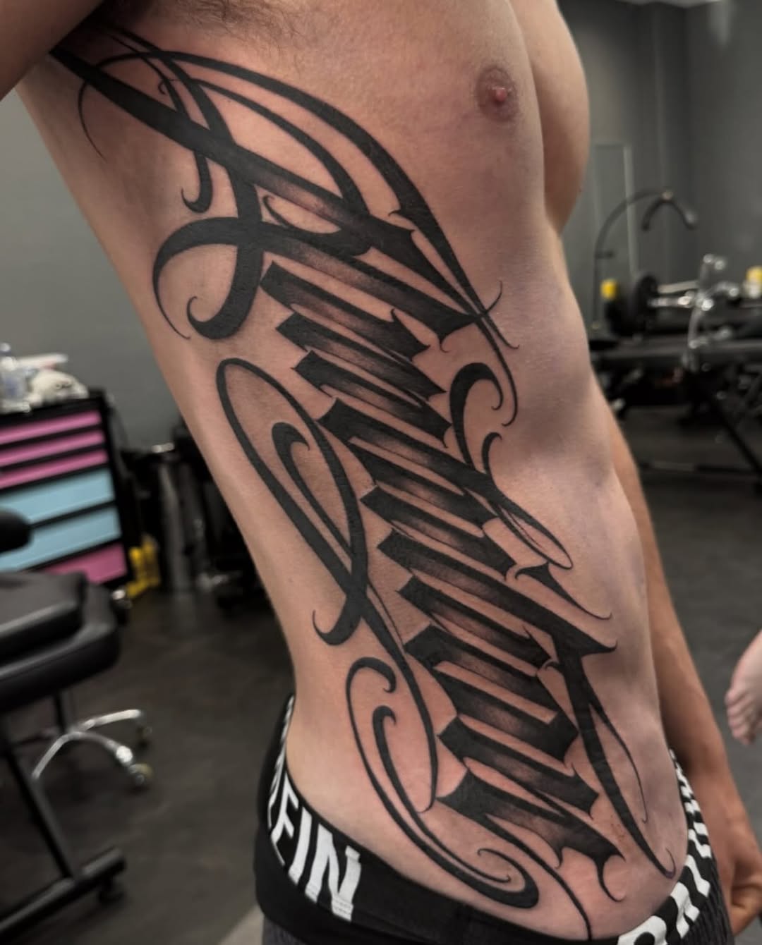 Tattoo by @dopeletterstattoo — lettering_script, blackwork
