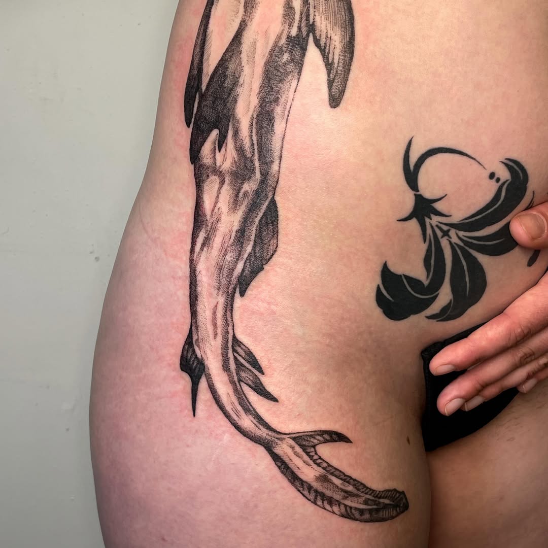 Tattoo by @iris.tats — black_and_grey, illustrative